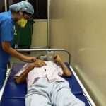 Anesthetist examining patient