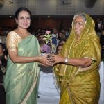 Dean felicitating Sarchitnis madam on eve of faculty night