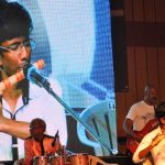 Student performing during gathering